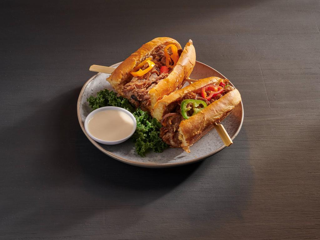 Philly Cheese Steak Sandwich · Shredded beef steak mixed with green and red pepper and onion, topped with your choice of cheese. Served on homemade hoagie bread.