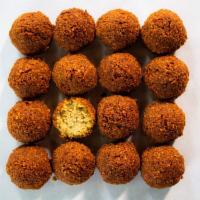 Falafel Ball · 1 per order comes with pickled cabbage, banana peppers,  tomatoes, pickles, lettuce and tahi...
