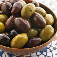 Kalamata Olives · Kalamata lightly tossed in Olive Oil. May contain Pits

*Price per 1/2 lb.