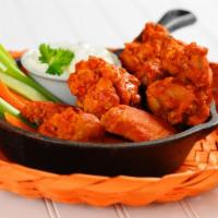 Buffalo Wings · Cooked wing of a chicken coated in Buffalo sauce.