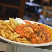 Camarones al Ajilo · Shrimp sauteed in garlic and mild guajillo peppers. Little spicy.