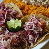 Mexican Style Taco Dinner · 3 tacos with rice and beans.