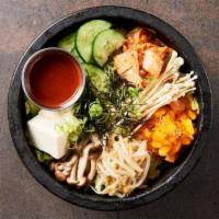 World Famous Namu Stonepot Rice · 7 vegetables, tofu, kimchee, sesame on a bed of sizzling koshihikari rice. Finished with Oth...