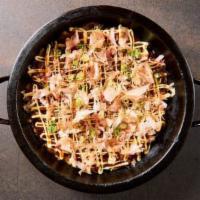 Okonomiyaki · Lightly crispy and gooey savory pancake made with kimchee, scallion, cabbage, yamaimo, bonit...