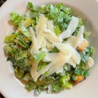 Caesar Salad · Romaine, shaved Parmesan, croutons and Caesar dressing.