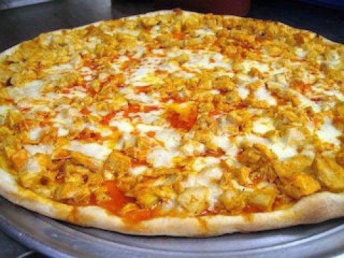 Buffalo Chicken Bacon Pizza · Chicken,  bacon, red onions, cheddar cheese, and green onion served with Frank's hot sauce.