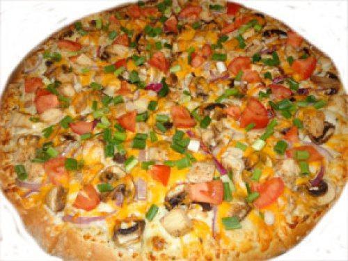 Garlic Chicken Pizza · Garlic white sauce, fresh mushrooms, red onions, roasted chicken, Roma tomatoes, green onion, and cheddar cheese.
