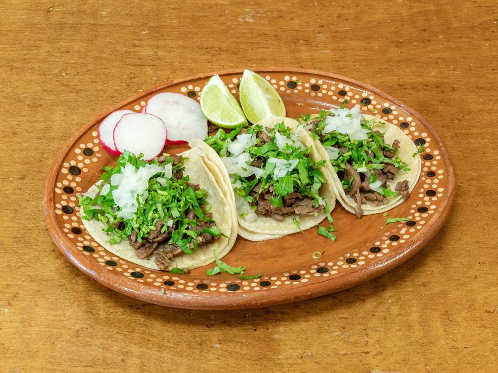 3 Taco Platillo · 3 Tacos served with onions and cilantro with a side of rice and beans.