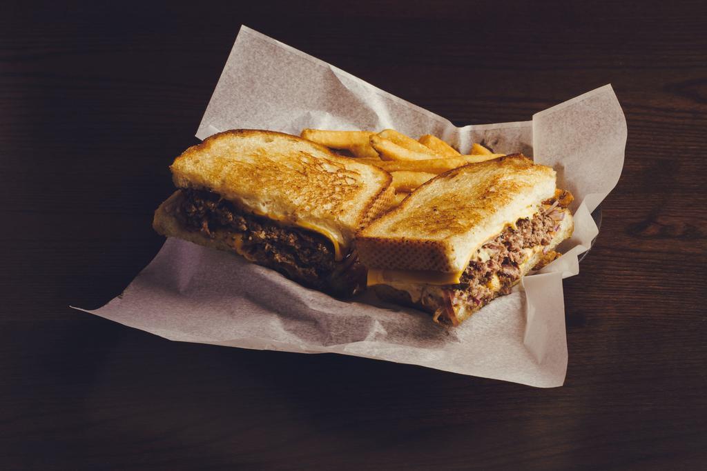 Frisco Patty Melt · 1/2lb smash burger w/ sautéed red onions, American cheese, Swiss cheese & thousand island dressing on sourdough toast.