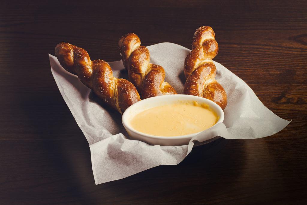 Pretzels + Beer Cheese · Soft salted Bavarian pretzel twists w/ beer cheese dip.