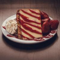 Strawberry Cheesecake · A colossal slice of New York cheesecake topped w/ strawberries, strawberry puree and whipped...