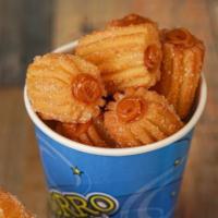 Churro Bites Filled · 22oz cup of our delicious churro bites covered in sugar and filled with your favorite toppin...