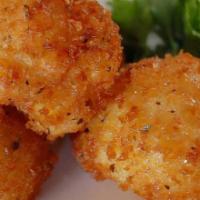 Mac ＆ Cheese Balls (4) · (4) Creamy mac ＆ cheese, panko crusted ＆ deep fried. Served with homemade ranch dressing.
