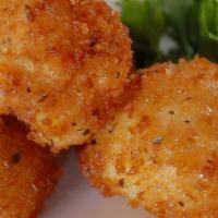 Mac ＆ Cheese Balls (8) · (8) Creamy mac ＆ cheese, panko crusted ＆ deep fried. Served with homemade ranch dressing.
