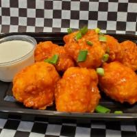 Homemade Buffalo Cauliflower · Our homemade Buffalo Cauliflower is freshly fried, breaded cauliflower, tossed in our spicy ...