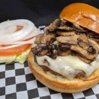 Mushroom Swiss Veggie Burger · A veggie burger topped with swiss cheese and sauteed mushrooms, served on a brioche bun, wit...