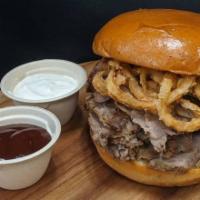 Tri-Tip Sandwich · Marinated and roasted Tri-Tip on a brioche bun, with crispy onion straws on top. Served with...