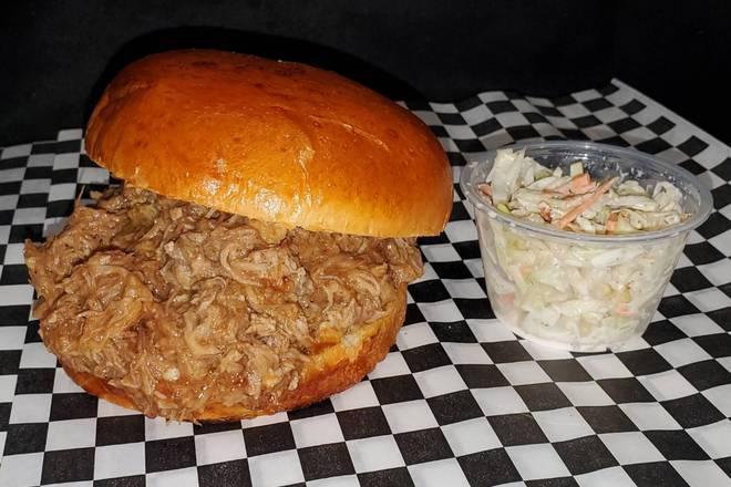 Pulled Pork Sandwich · Our homemade low-n-slow pulled pork, piled high on a brioche bun, with BBQ sauce and coleslaw. 