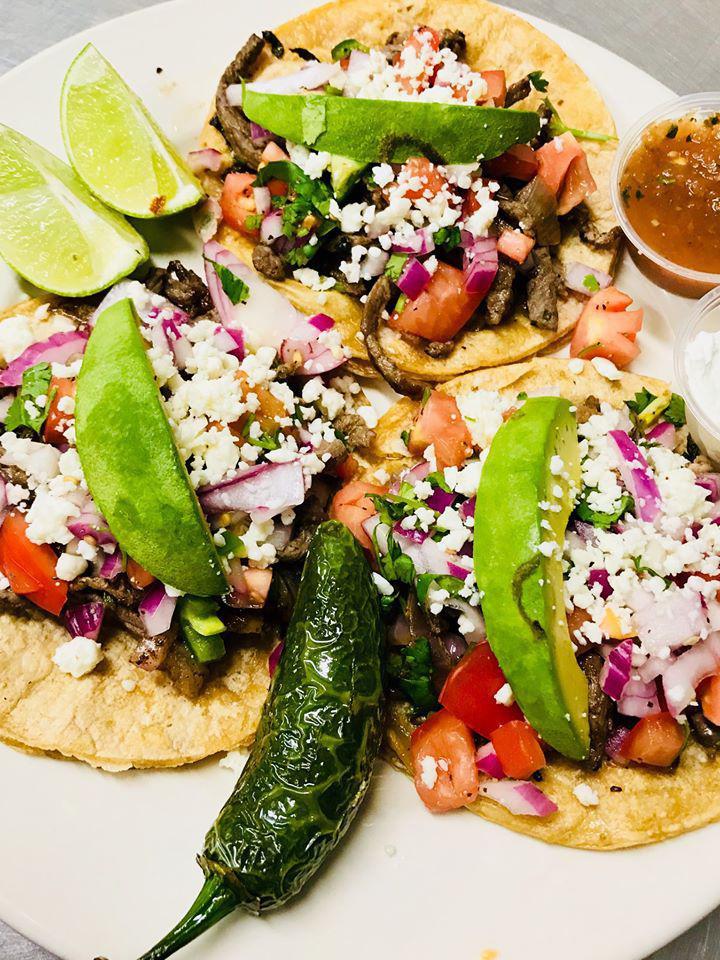 Cantina Tacos · Three tacos with choice of carnitas, steak, chicken, shrimp or fish, topped with homemade pico de gallo, avocado, queso fresco, on a corn tortilla. Served with rice and beans, and sour cream and salsa.