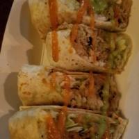 Burrito Bites · 4 dipping-size portions of our delicious burrito served with our fresh guacamole. Cotija che...