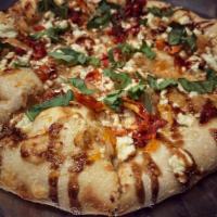 Sticky Fingers · Apricot preserves, caramelized onion, sun dried tomatoes, fresh basil, shaved parmesan, goat...