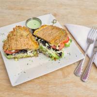 Patacon Vegetarian  · Black beans, fresh avocado, queso blanco, sweet plantain, fried egg, lettuce, tomato, onion ...