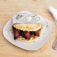 Pollo Asado Arepa · Grilled chicken and cheese.