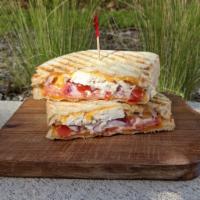 Chicken Bacon Ranch Panini · Sourdough or 7-Grain Bread, Bacon Strips, Diced Chicken Breast, Cheddar Cheese, Tomatoes, Re...