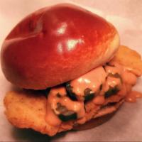 Average Cluck  · Crispy fried chicken filet on brioche bun with pickles and rooster sauce.