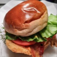 Cluckin’ Clubber  · Fried or grilled chicken with bacon, lettuce, tomato, rooster sauce on brioche.