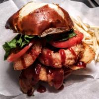 Oh My Cluck  · Fried or grilled chicken w/ cheddar, bacon, onion rings, lettuce, tomato, BBQ sauce on pretz...