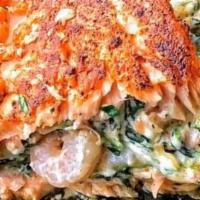 Seafood Stuffed Salmon · Seafood stuffed salmon creamy spinach and shrimp combination stuffed in a salmon fillet. Ser...