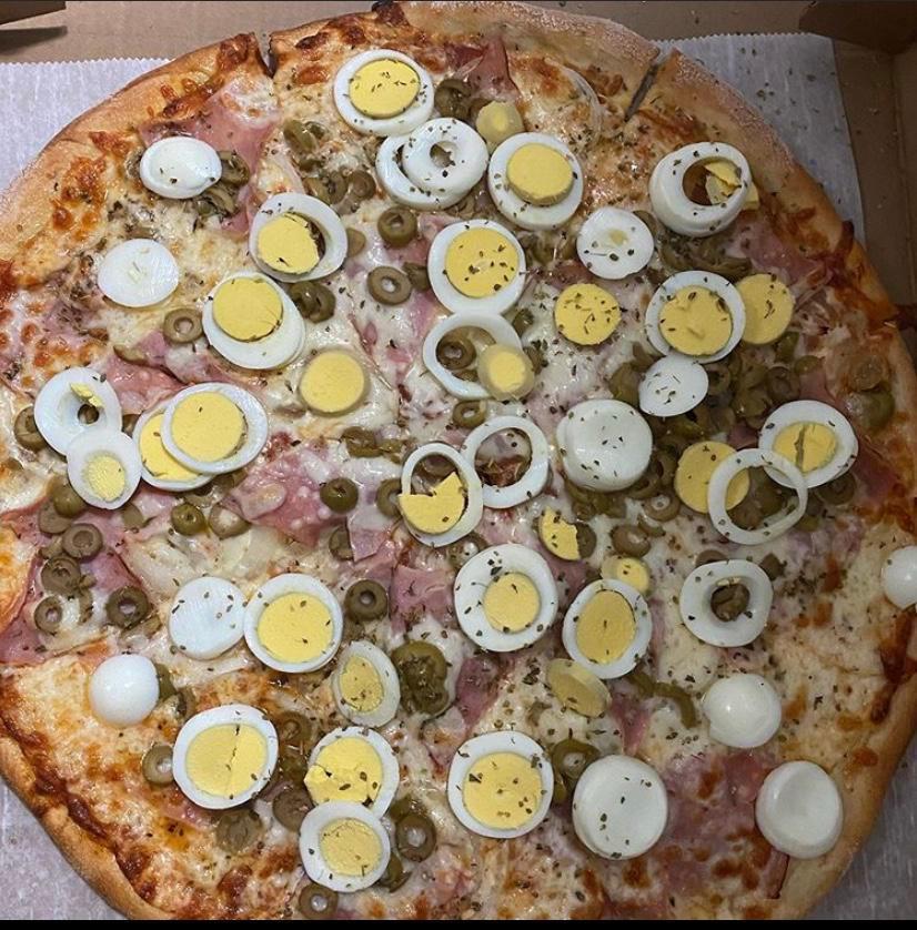 Portuguesa Pizza · Onions, olives, ham, eggs, mozzarella cheese and oregano.