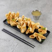 12. Crab Rangoon · 10 pieces. Wheat. Fried wonton wrapper filled with crab and cream cheese.