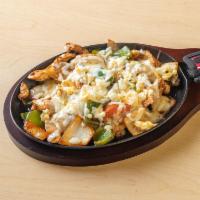 Pollo Fajitas · Chicken, green and red bell pepper, onions, tomatoes. Comes with three tortillas.