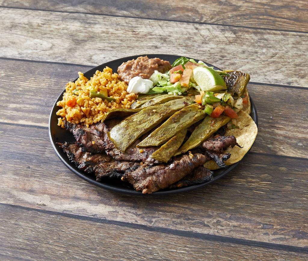 Carne Rey Del Taco · Charbroiled skirt steak with pico de gallo and grilled cactus, pico de gallo y nopales.