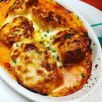 Aunt Angie's Stuffed Shells · Homemade shells stuffed with ricotta, spinach, and mozzarella with vodka sauce