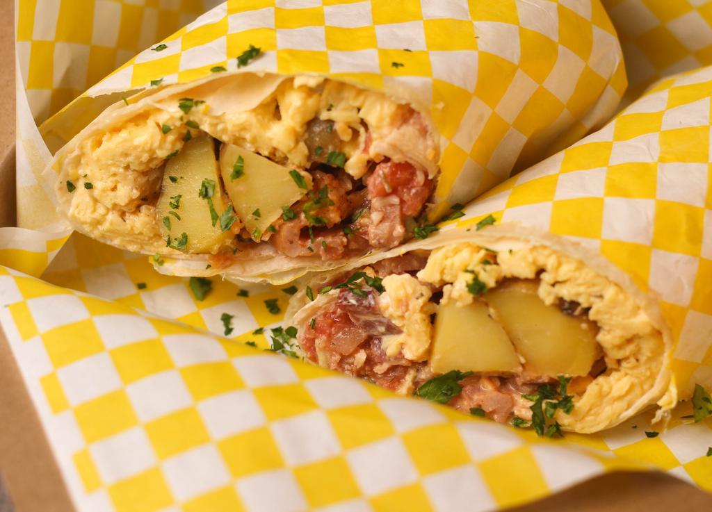 Biggie Breakfast Burrito · Large flour tortilla with sour cream, salsa, scrambled eggs, country potatoes, shredded cheese, avocado, choice of applewood bacon or ground breakfast turkey.
