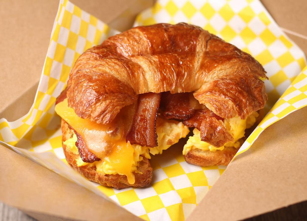Breakfast Sandwich · Available on brioche sliced bread or croissant. Comes with egg, cheese and your choice of applewood bacon, breakfast turkey patties or beef link.