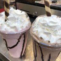 Malteadas · Milk shakes, made with real ice cream topped with whipped cream, and chocolate syrup.