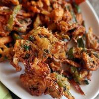 Pakora · Fresh sliced vegetables prepared with chick-pea flour, whole coriander, onions and other spi...