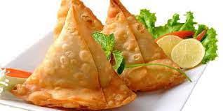 Vegetable Samosas · Triangular puffed-pastry stuffed with cubed potatoes, green peas, carrots and mildly spiced ...