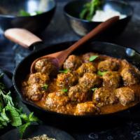 Lamb Meatball Curry · Lamb meatballs sauteed in India’s favorite yellow curry sauce cooked with grilled onions, tu...