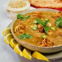 Goat Haleem · Made of mutton, wheat, lentils, spices, pure ghee made into a thick consistency with fried o...