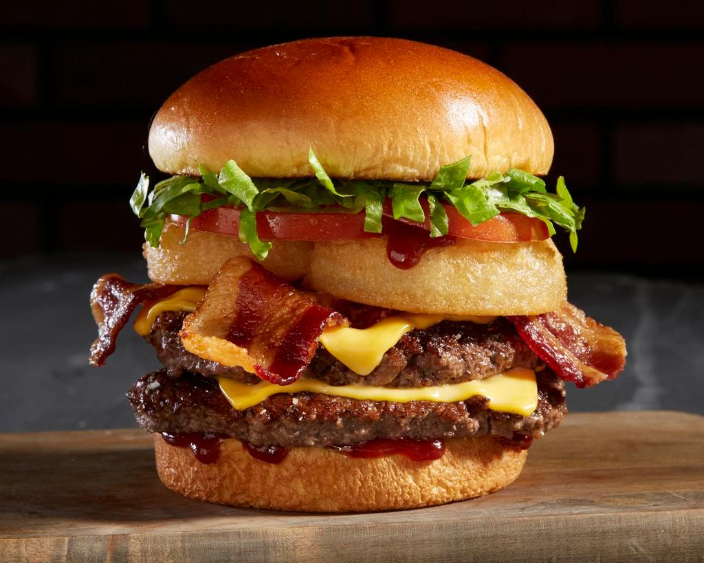 BBQ Bacon Tribeca Burger · 1/2 Lb Angus Beef, BBQ sauce, Ranch dressing, onion rings, bacon, lettuce, tomato and cheese.
