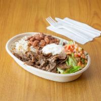 Shawarma Bowl · Beef Shawarma with rice , lettuce, pinto beans, pico de gallo and sour cream