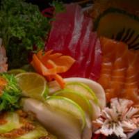 Sashimi Deluxe · Raw. 15 pieces. 3 salmon, 3 tuna, 3 white fish, 3 eel, 3 shrimp.
