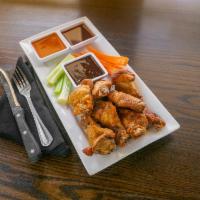 Wings · Spicy! Bone-in wings. One pound. Served with your choice of spicy guinness honey, curried ap...