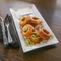 O' Rings · Crispy beer-battered onion rings served with chive ranch or bleu cheese dressing.