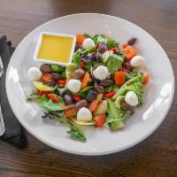 Marinated Vegetable Salad · A mix of Kalamata olives, marinated tomatoes, artichoke hearts, baby corn, roasted red peppe...